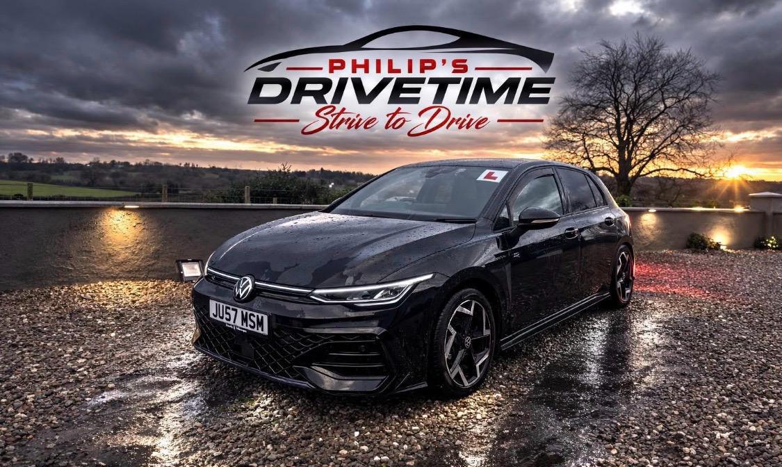 Philip's Drive Time tuition car, a black Volkswagen Golf R Line, at sunset